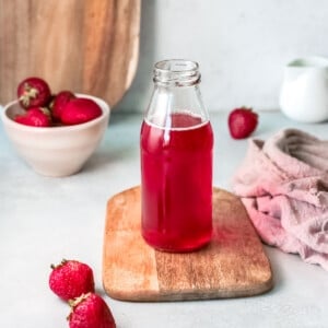 strawberry simple syrup in a bottle