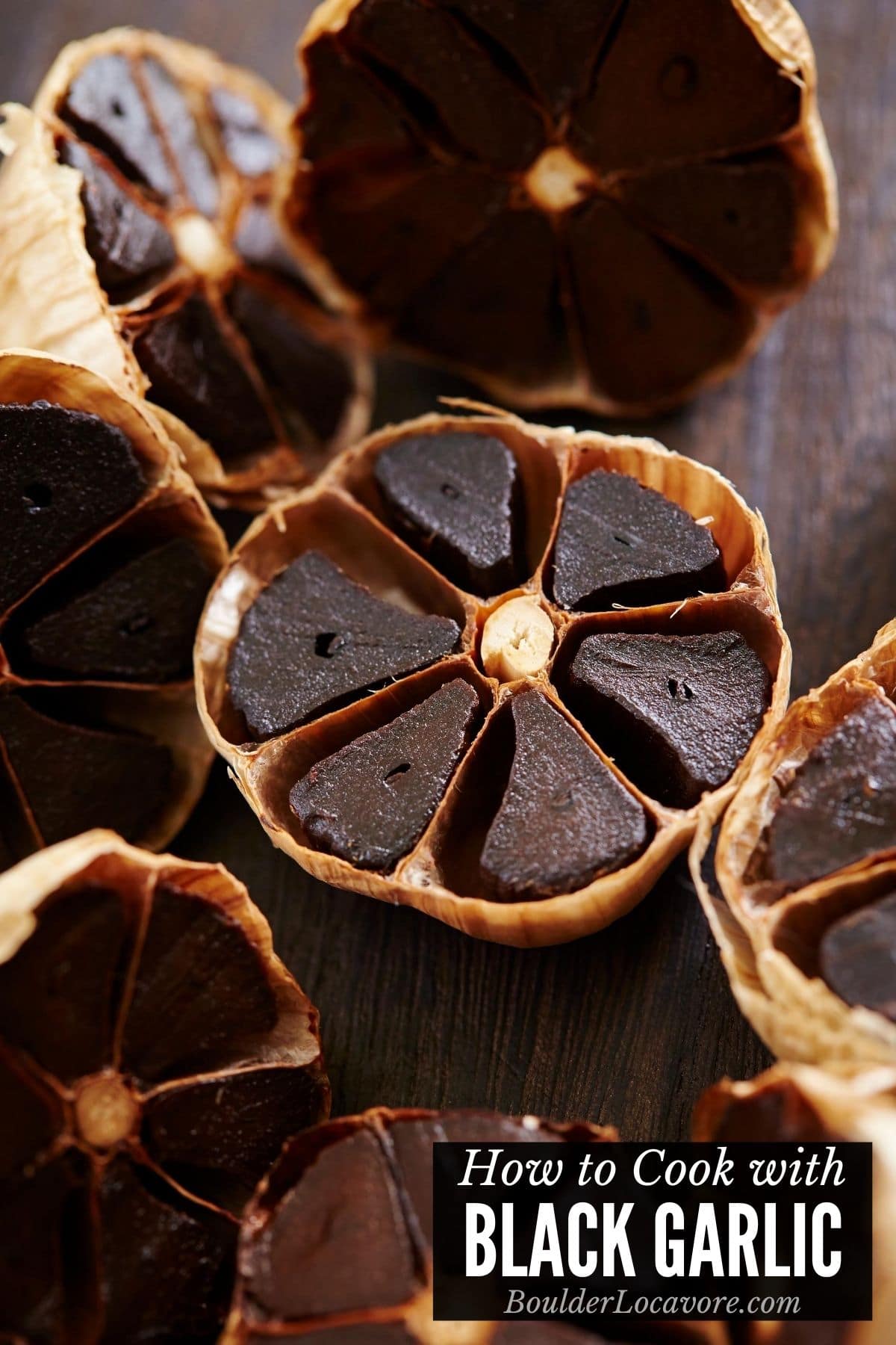 Halved head of black garlic with title