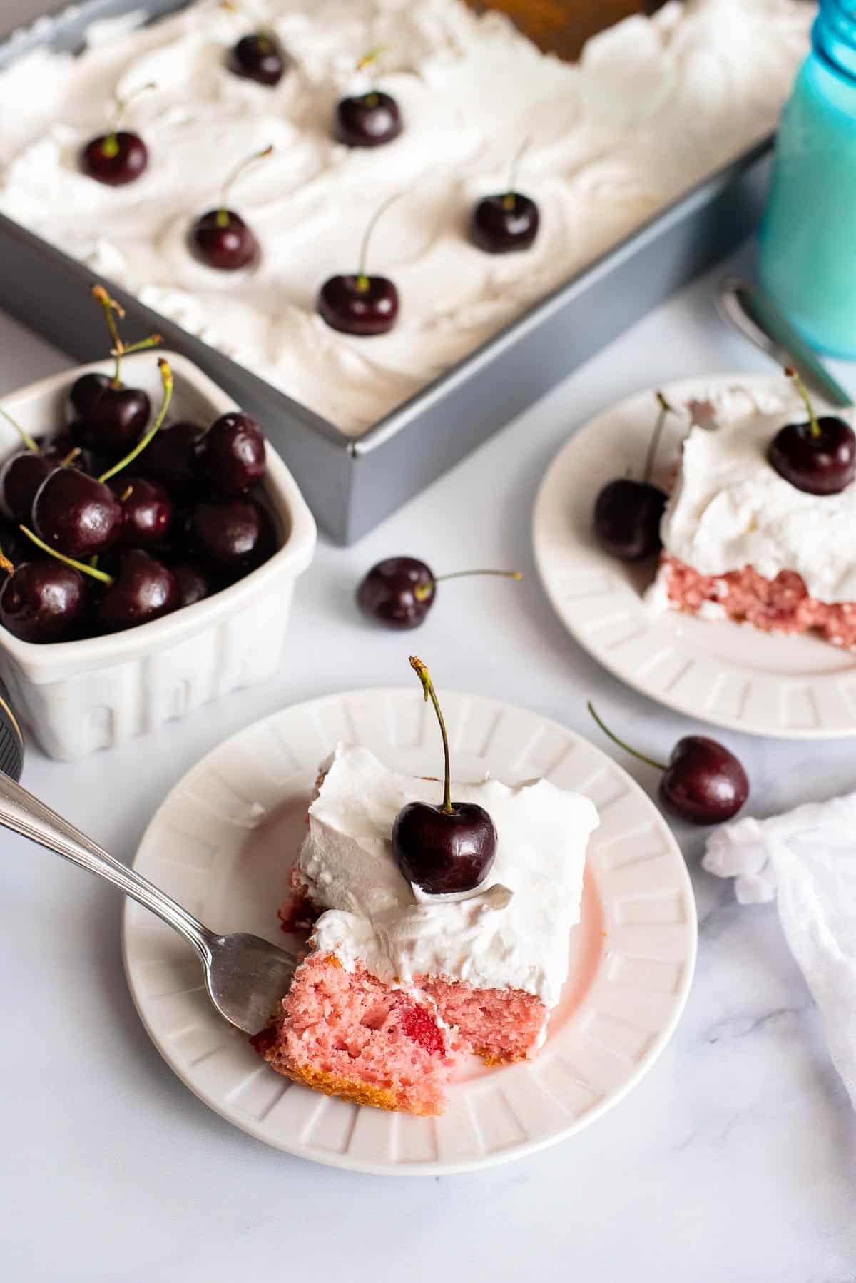 cherry cake slice with whipped cream overhead