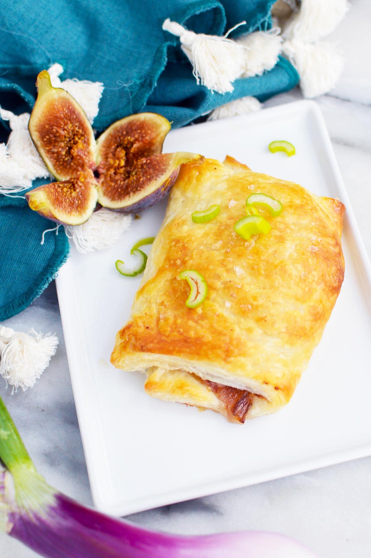 onion and fig puff pastry with figs on plate