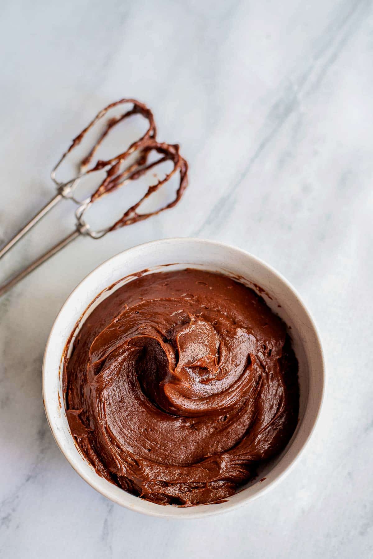 bowl of chocolate cream cheese frosting