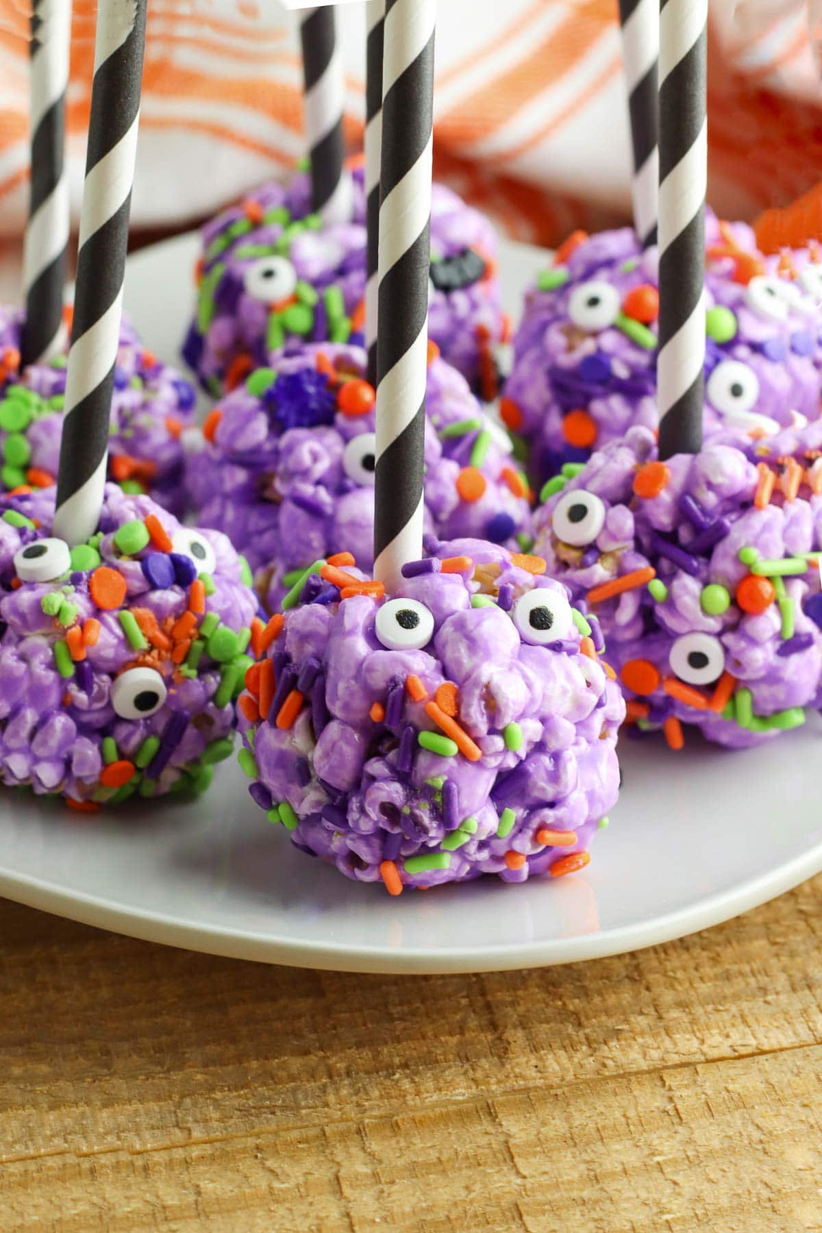 halloween popcorn balls with sticks on plate 