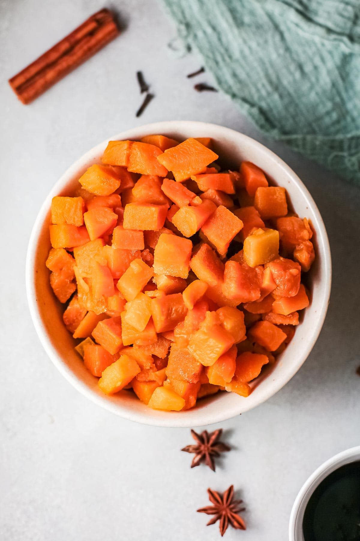 cubed pumpkin in white bowl