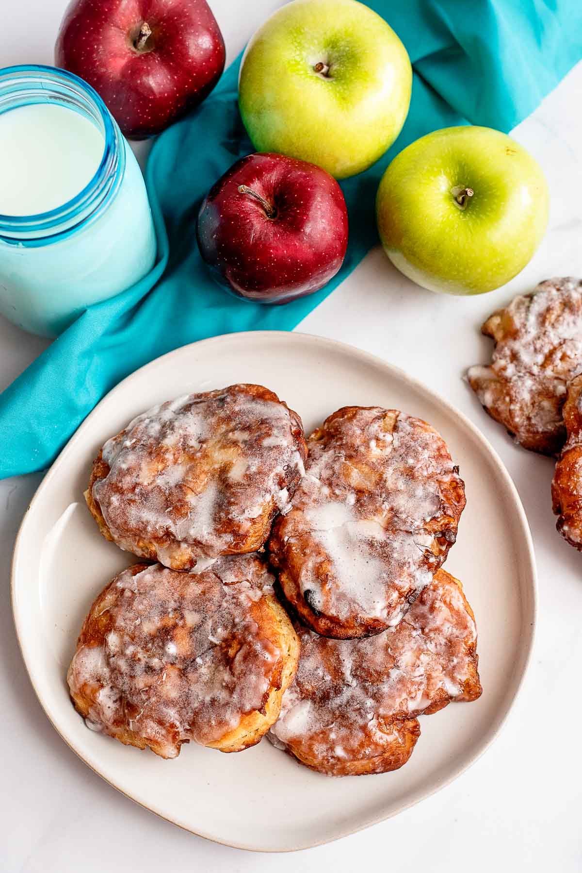 apple fritters on a plate overhead