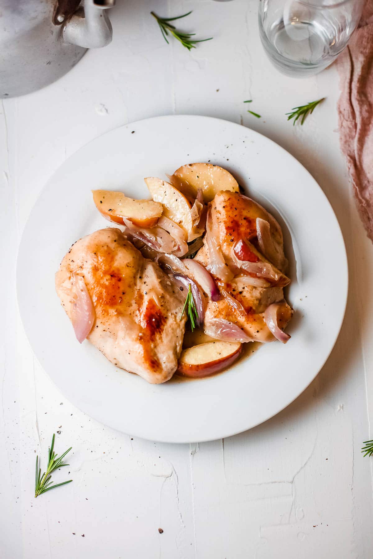 roast chicken breasts on plate with rosemary
