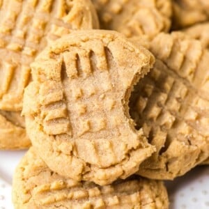 stacked peanut butter cookies with bite out