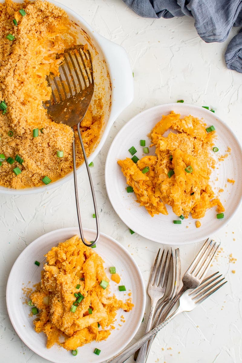 baked buffalo chicken pasta in pot and servings