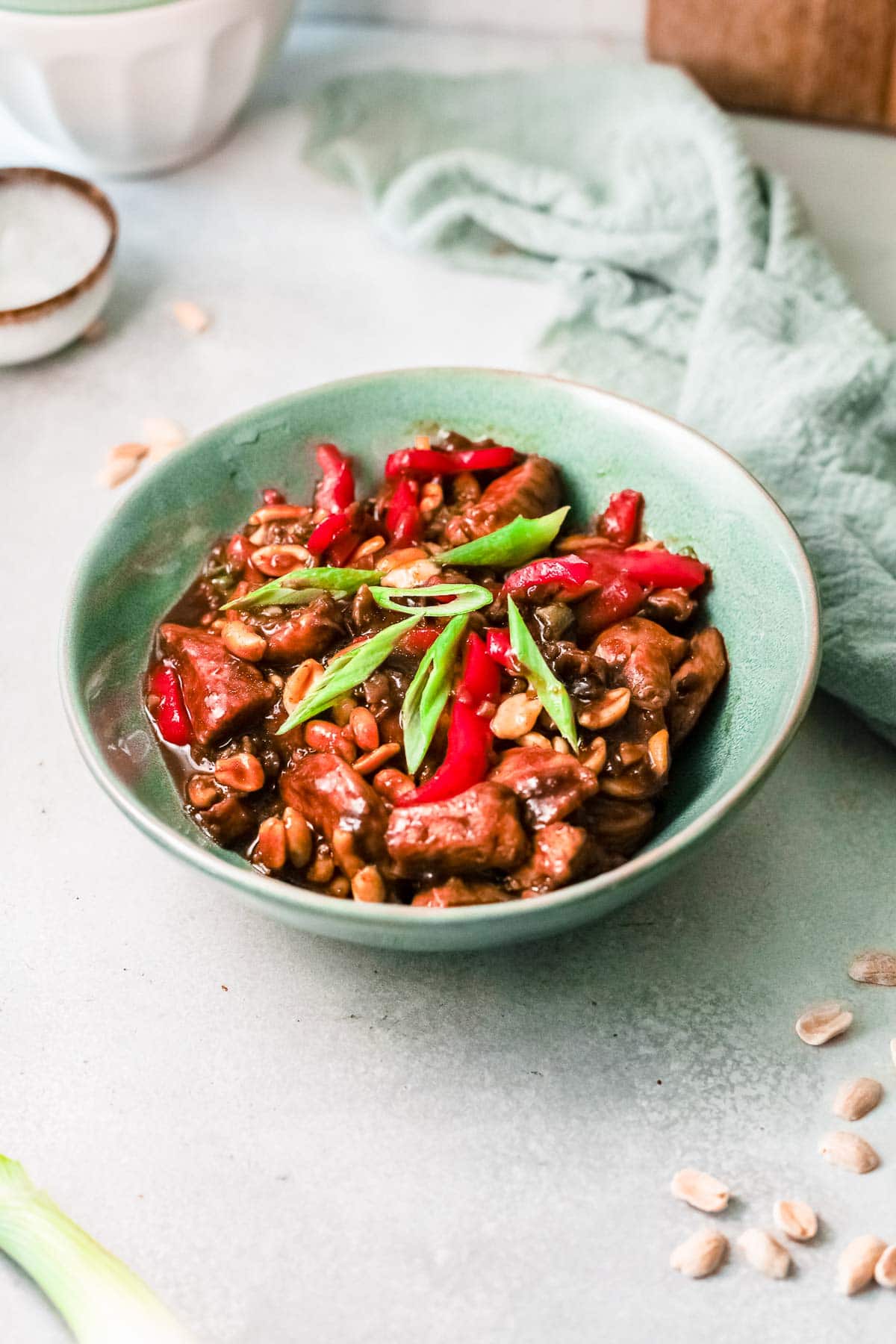 kung pao chicken in green bowl