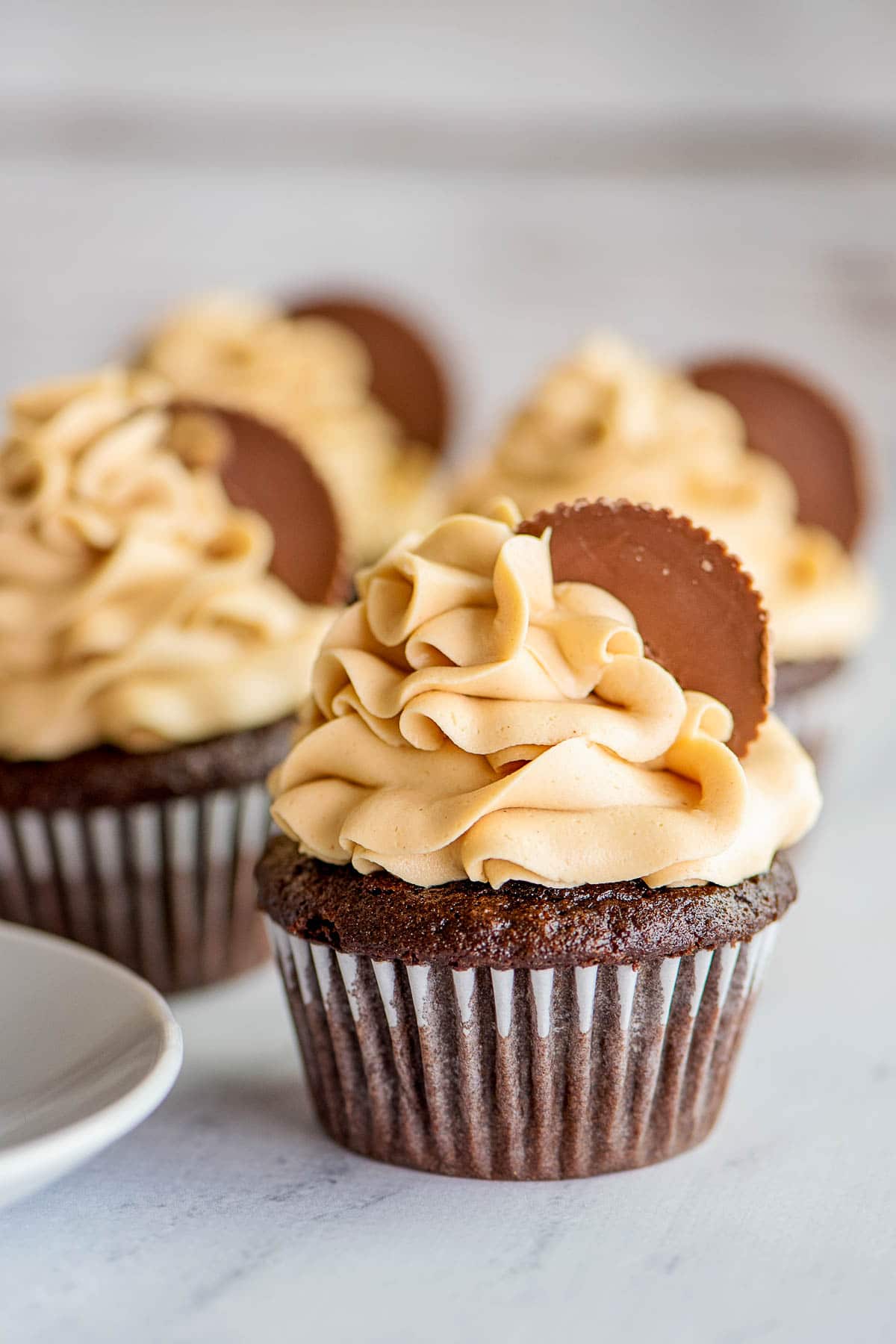 peanut butter frosting on chocolate cupcakes 