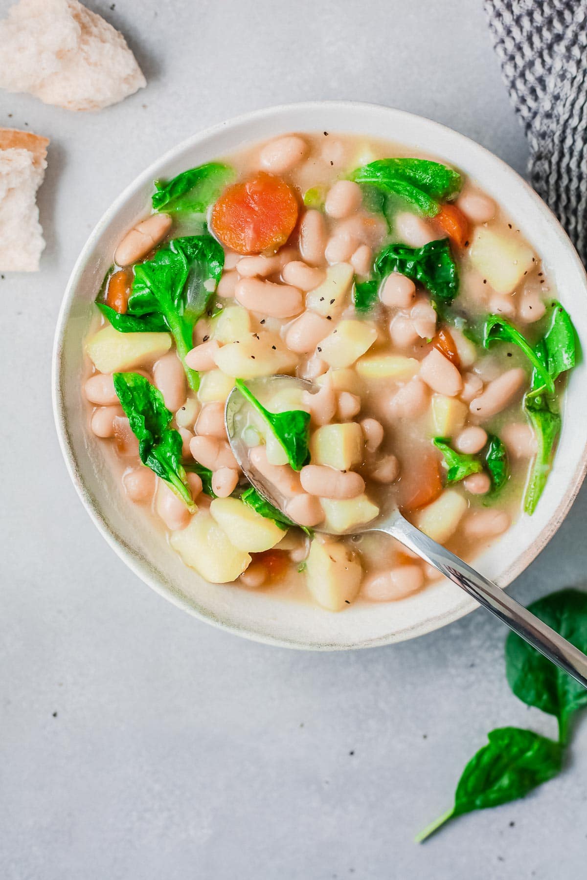 white bean soup with spoon overhead b