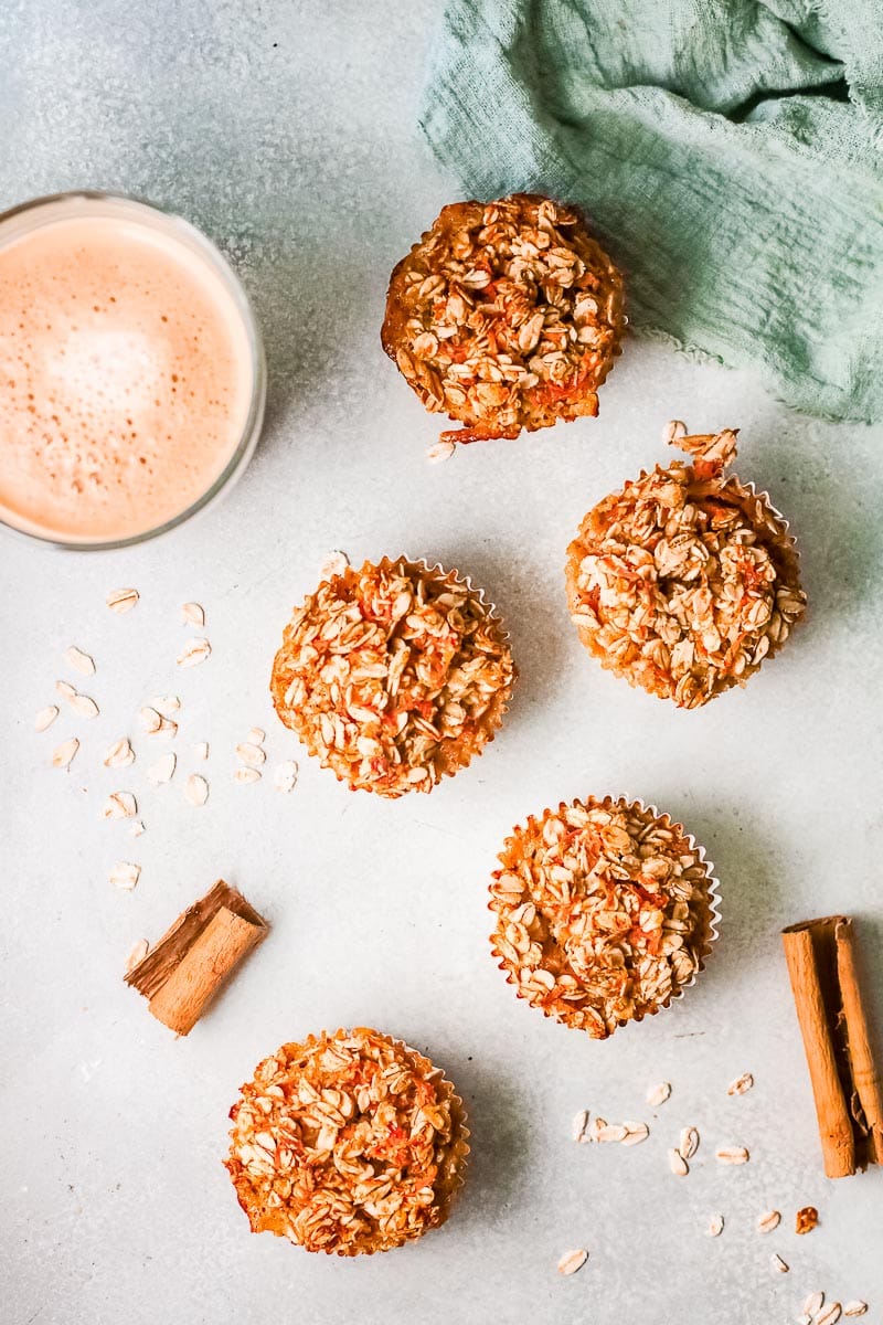 baked carrot cake oatmeal cups with coffee above 