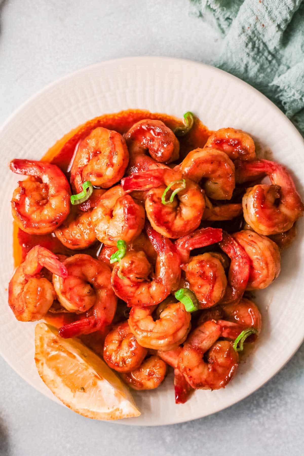 cajun shrimp on plate with lemon 