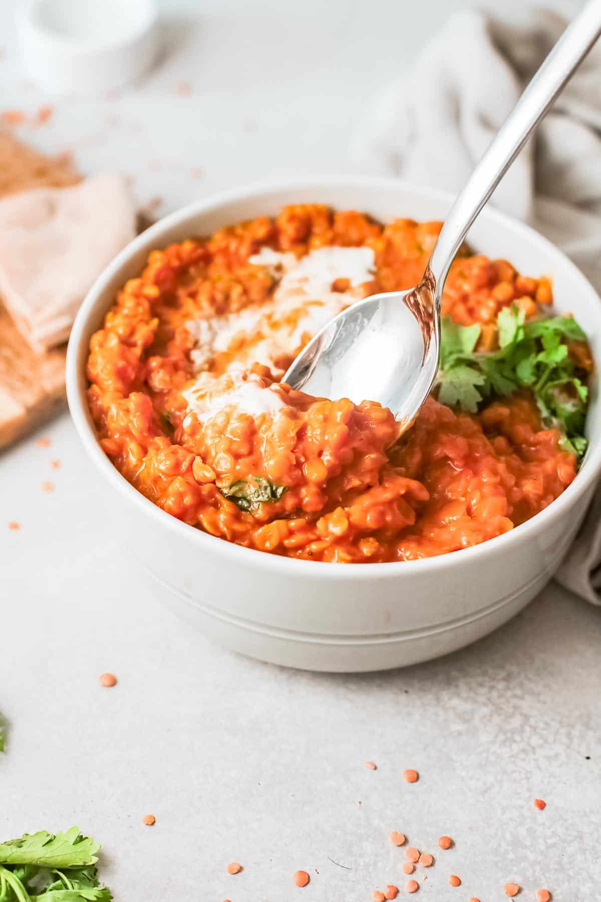 red lentil curry with spoon