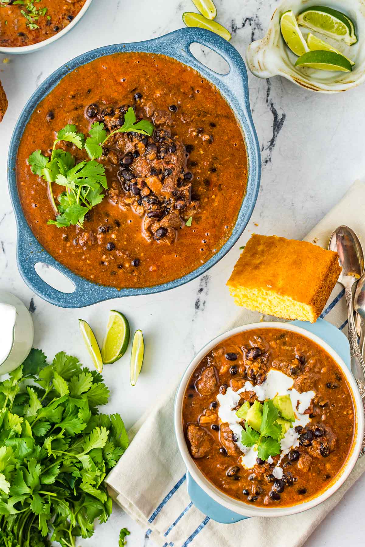 blue bowls of pork chili from overhead