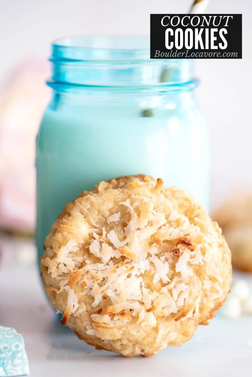 coconut cookies with blue jar of milk