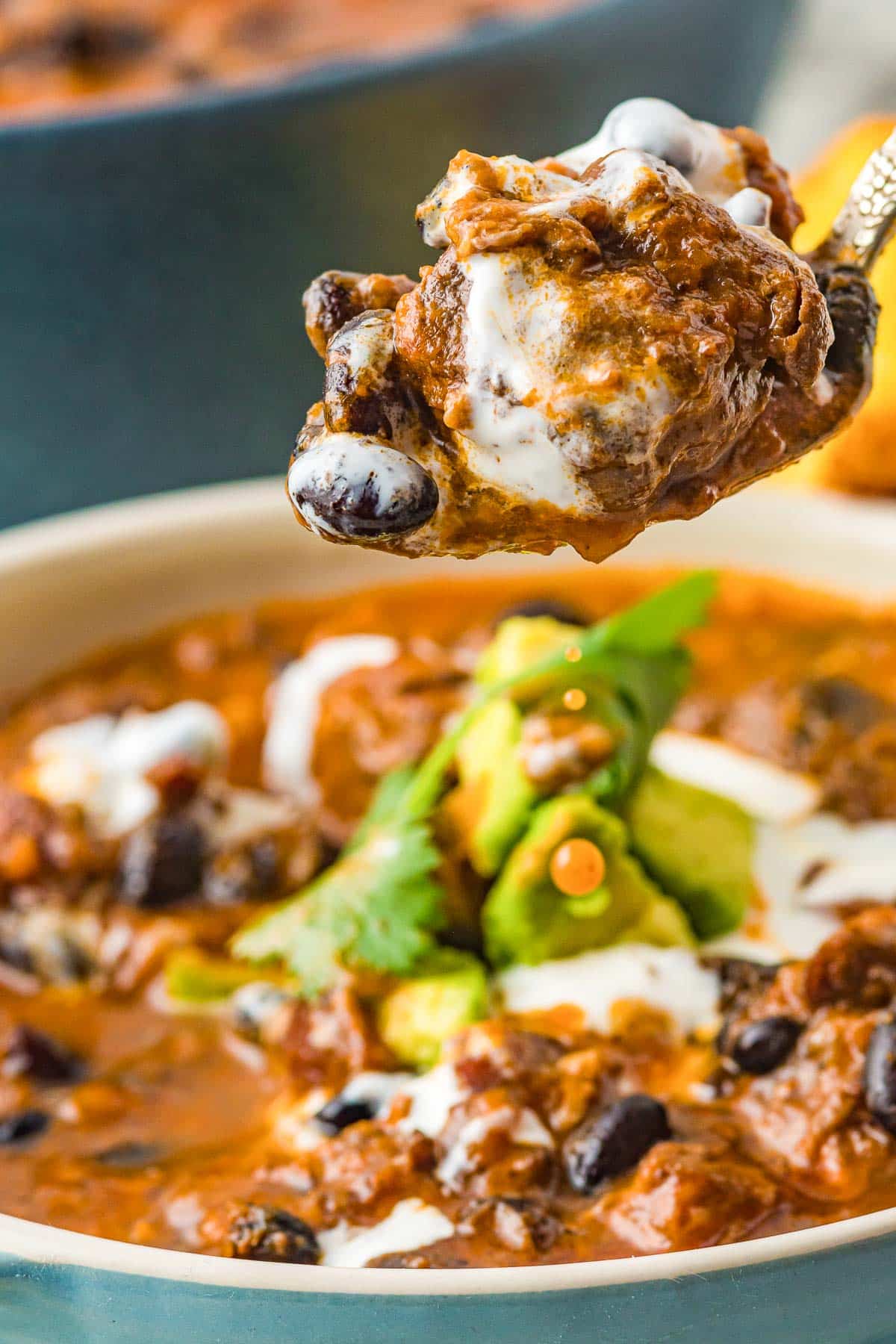 pork chili on a spoon close up