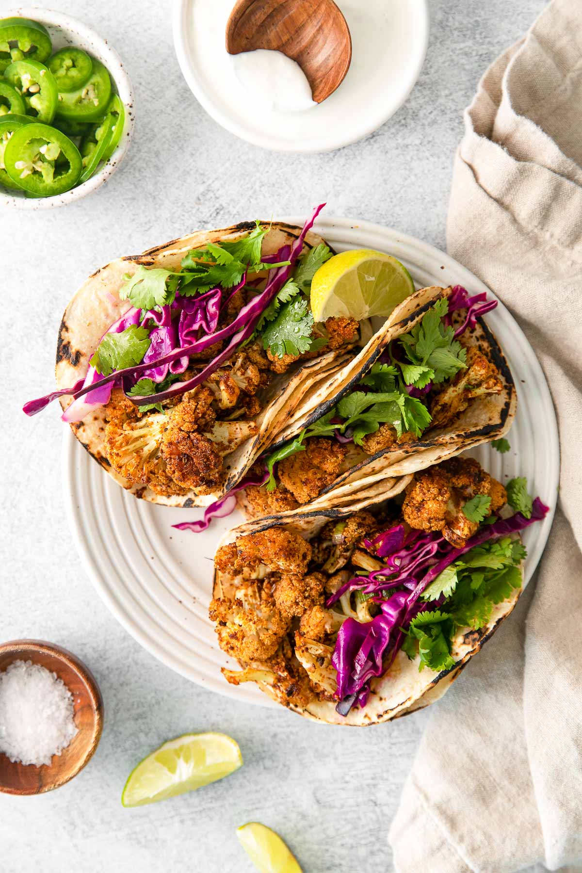 cauliflower tacos on white plate above