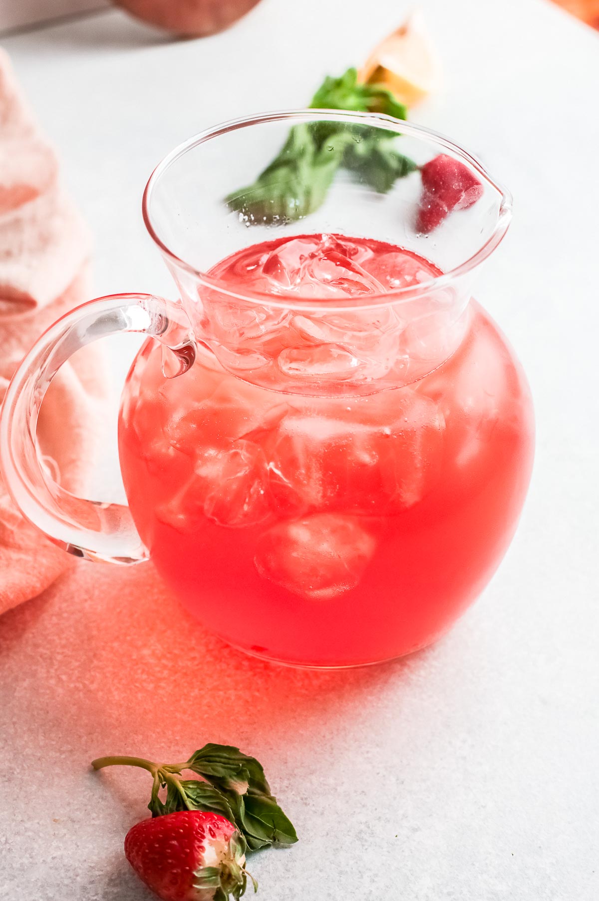 gin rickey pitcher with strawberry simple syrup