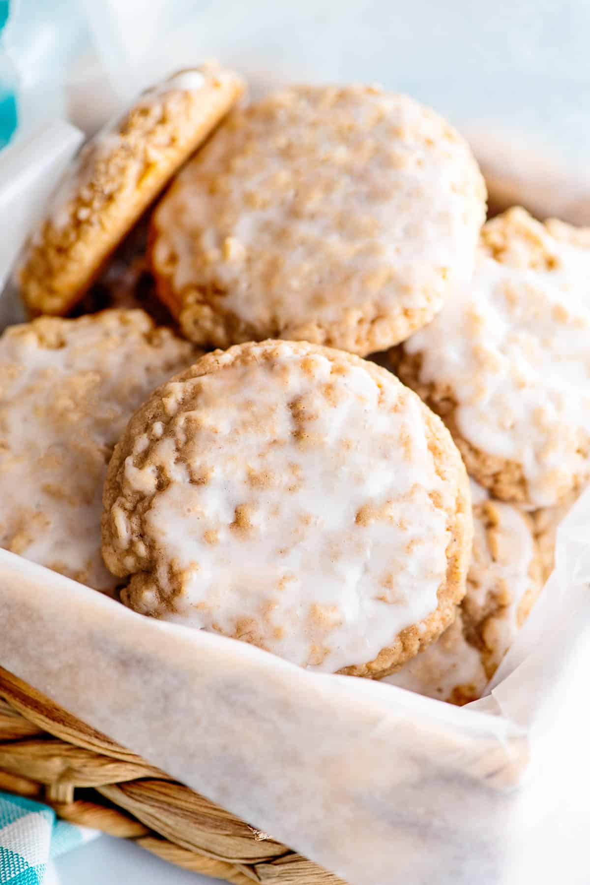 iced oatmeal cookies in a basket.