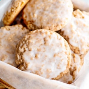 iced oatmeal cookies in basket close up.