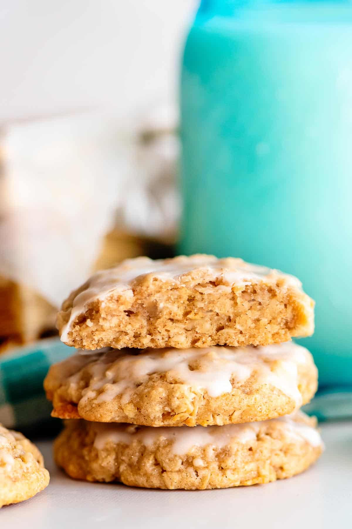 iced oatmeal cookies stacked.