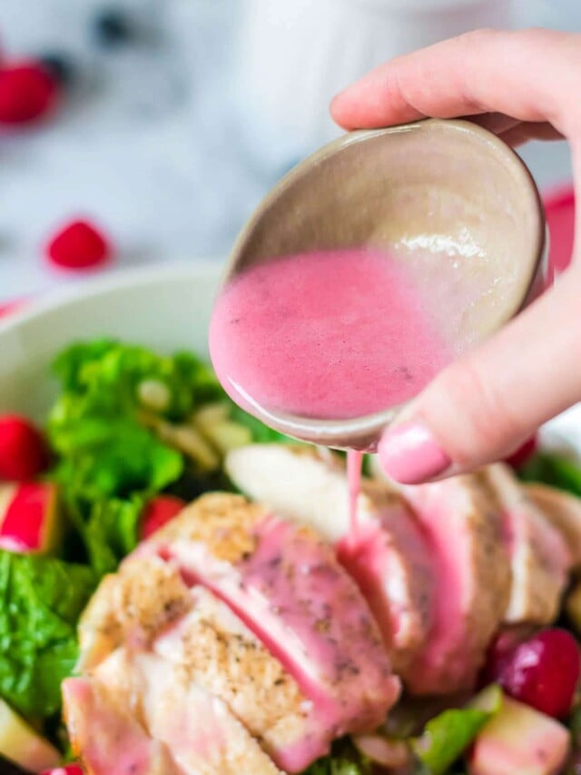 cropped-raspberry-vinaigrette-in-bowl-pouiring-onto-salad.jpg
