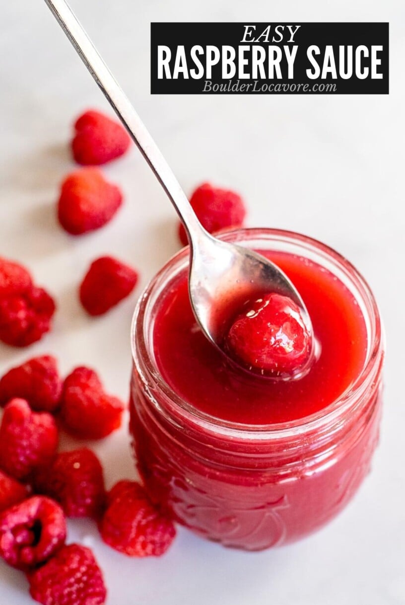 raspberry sauce in jar with spoon.