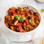 eggplant caponata in a bowl from side.