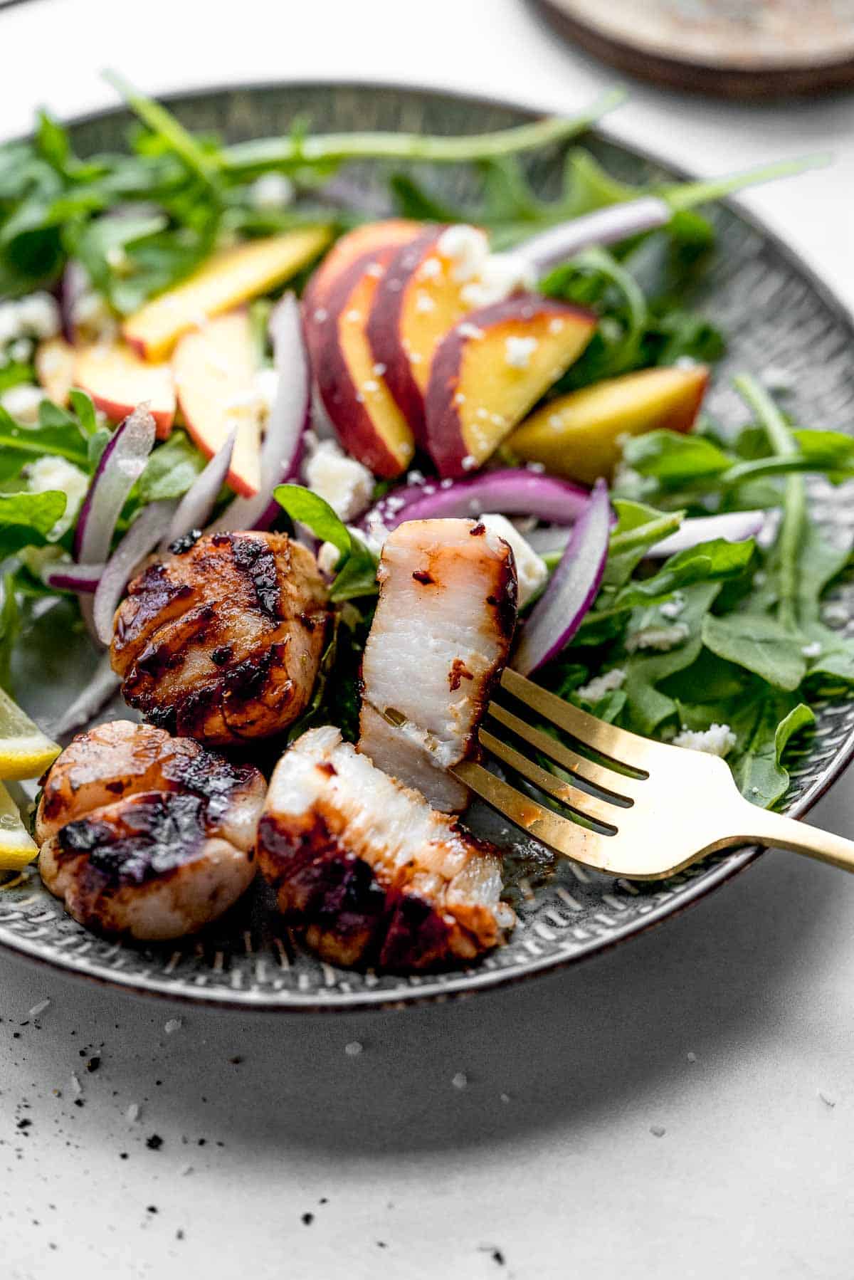 grilled scallops inside with salad.