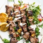 grilled steak greek kebabs on plate.