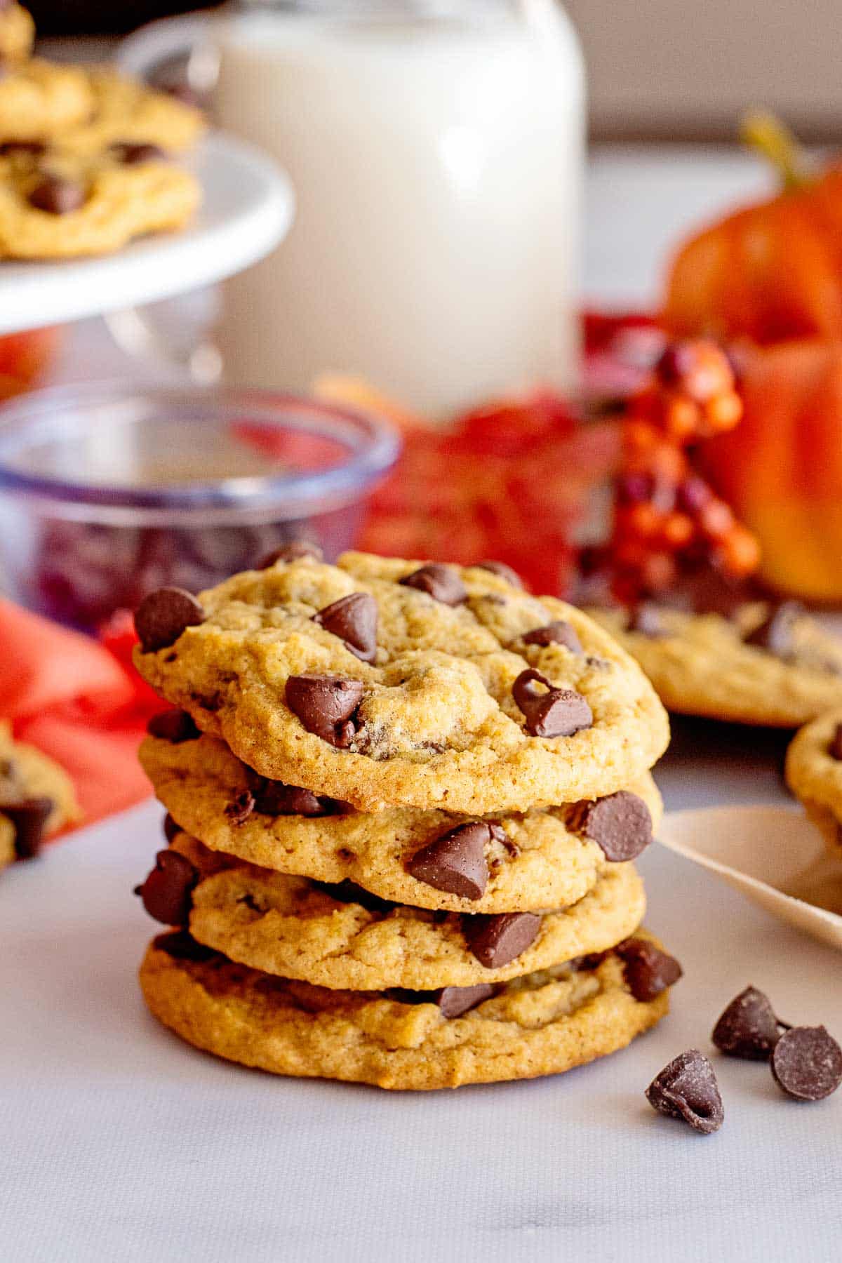 pumpkin chocolate chip cookies stack with milk.