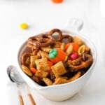 halloween chex mix in a white bowl.