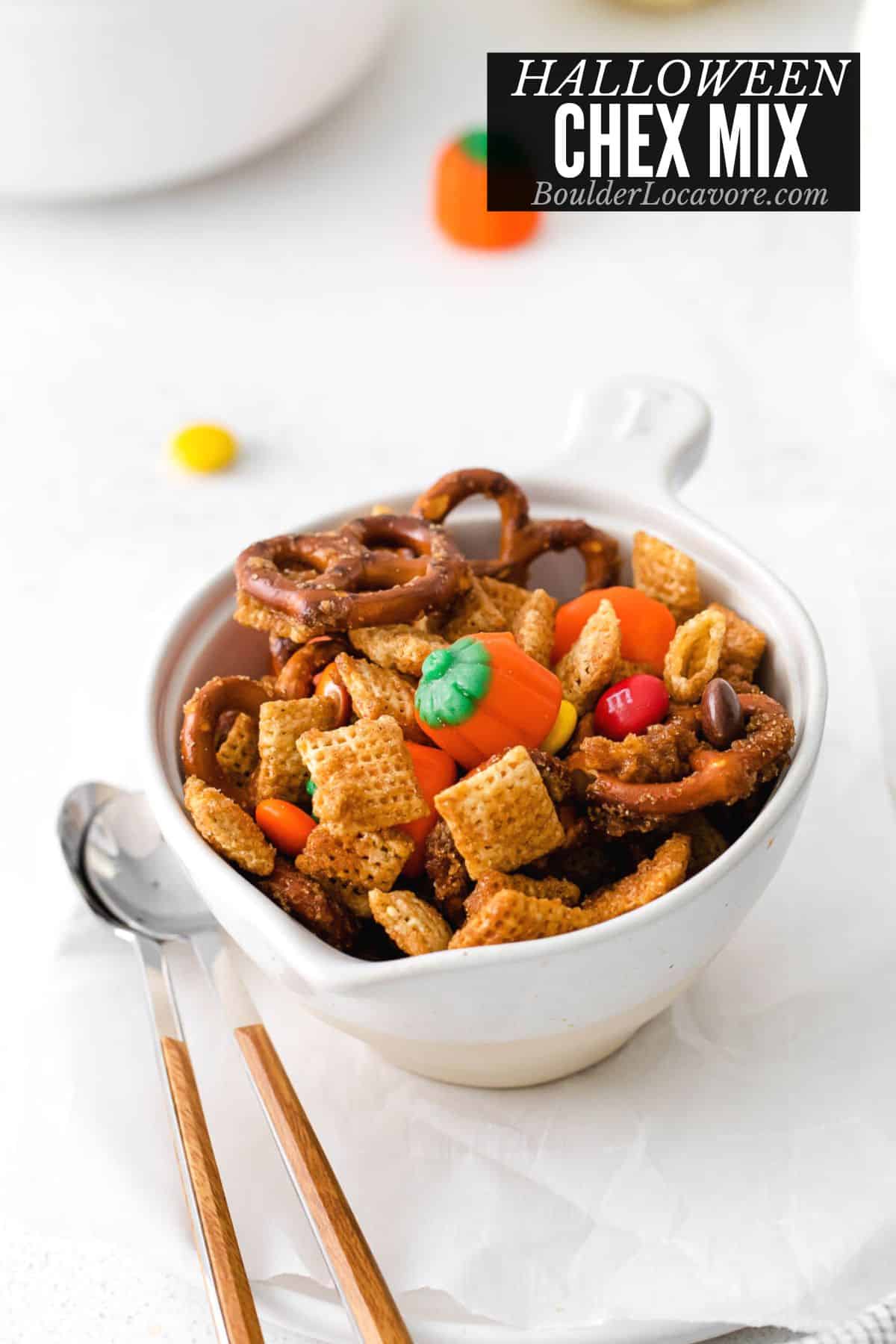 halloween chex mix in a white bowl.