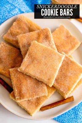 snickerdoodle bars in a pile on white plate