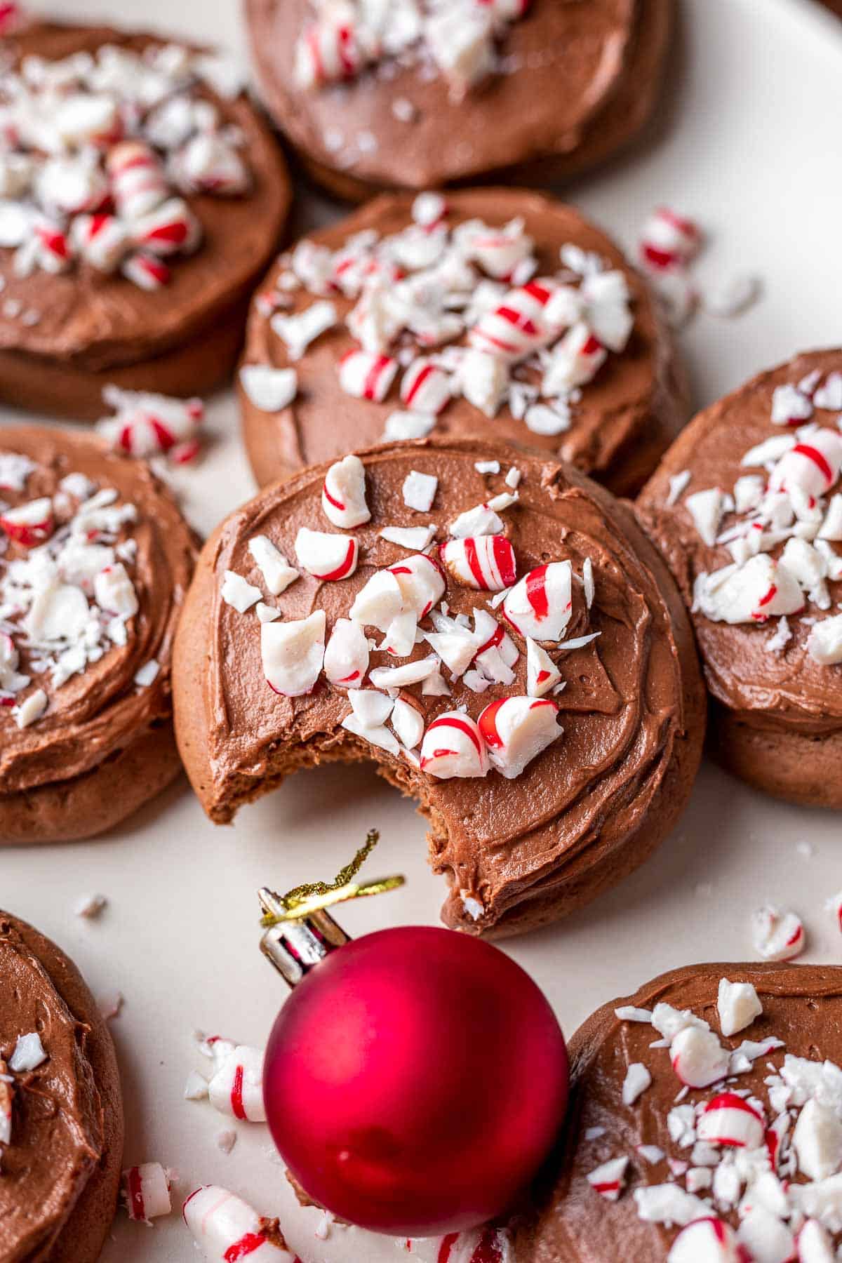 chocolate peppermint cookies with candies bite out.