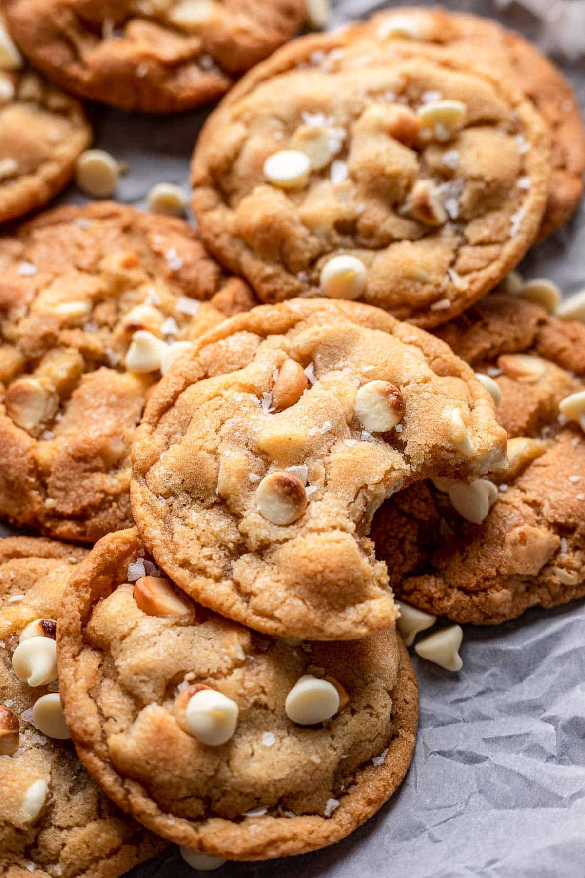 macadamia nut white chocolate cookies with bite out.
