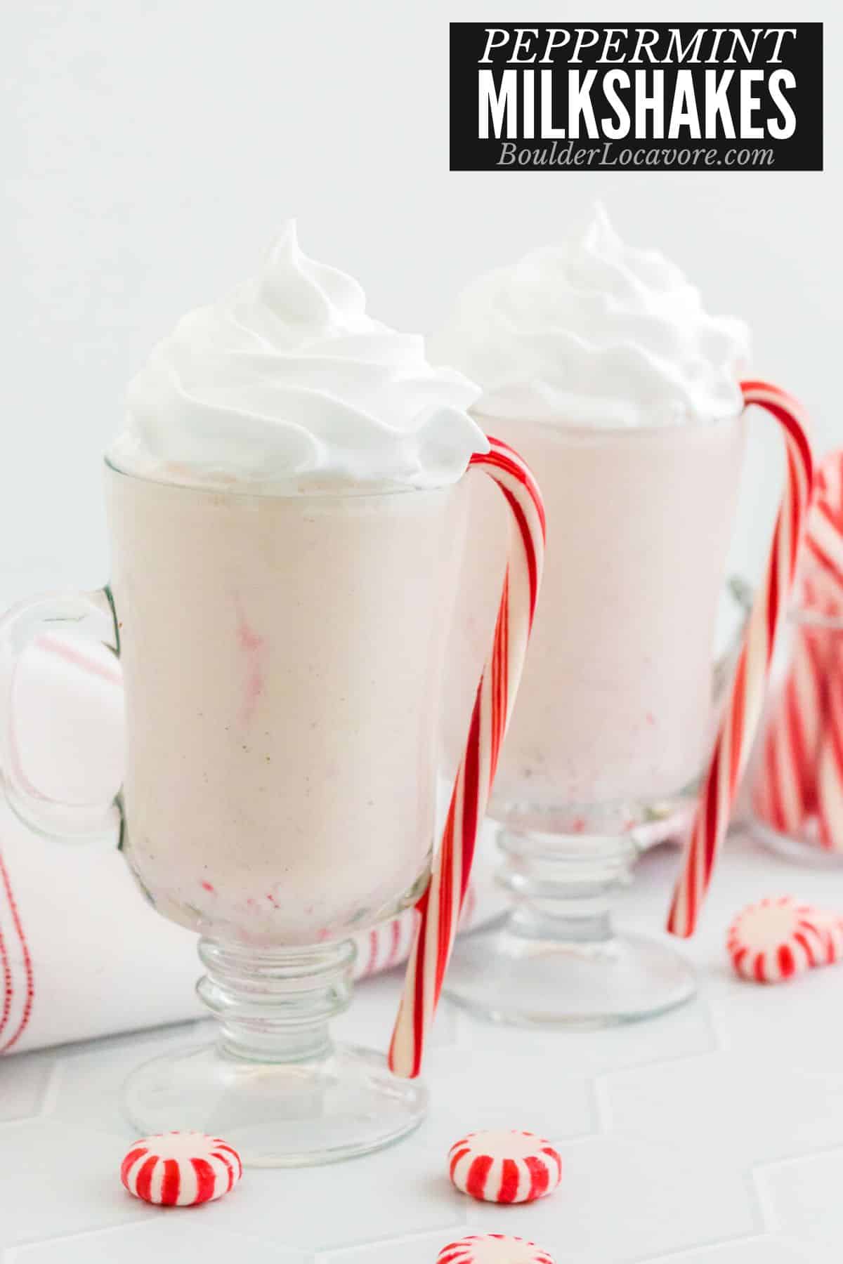 peppermint milkshakes with candy canes in glass mugs.