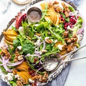 pear salad on platter with dressing