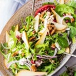 pear salad tossed in a large bowl.