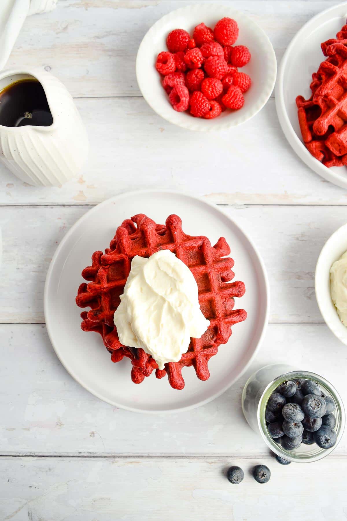 red velvet waffles overhead with topping