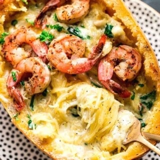 shrimp alfredo spaghetti squash on polka dot plate.