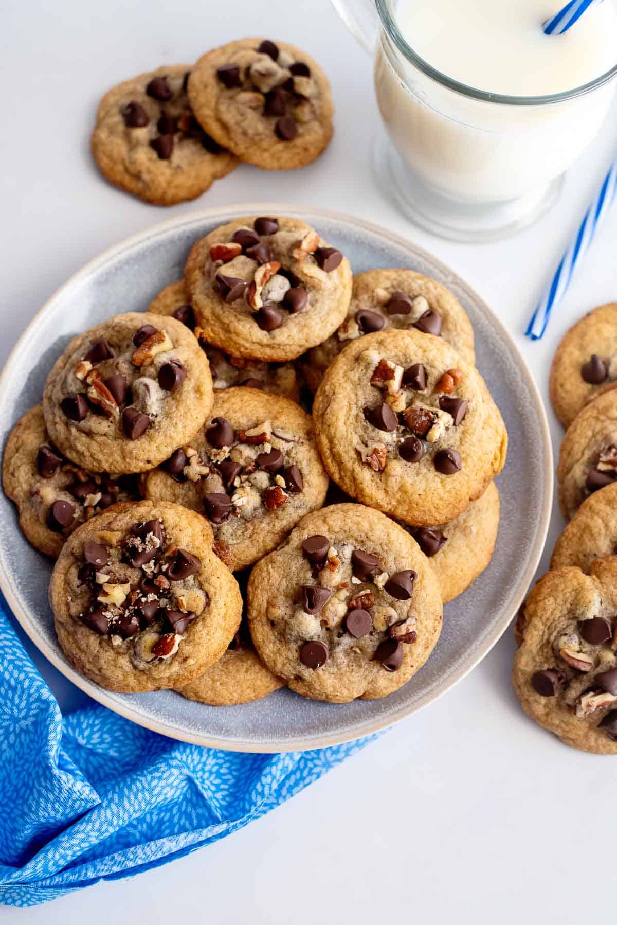 chocolate chip pecan cookies on a plate overhead.