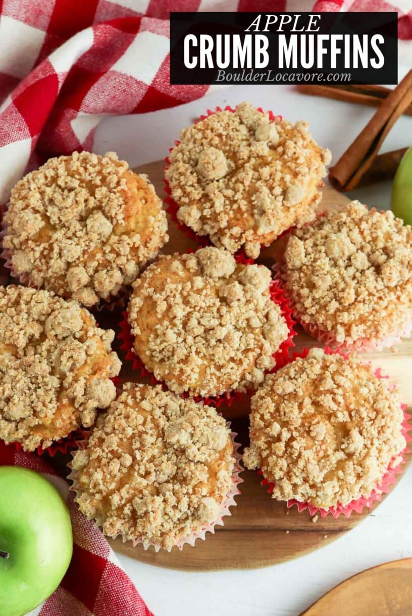 apple crumb muffins on cutting board.