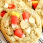 candy corn cookies on striped plate.