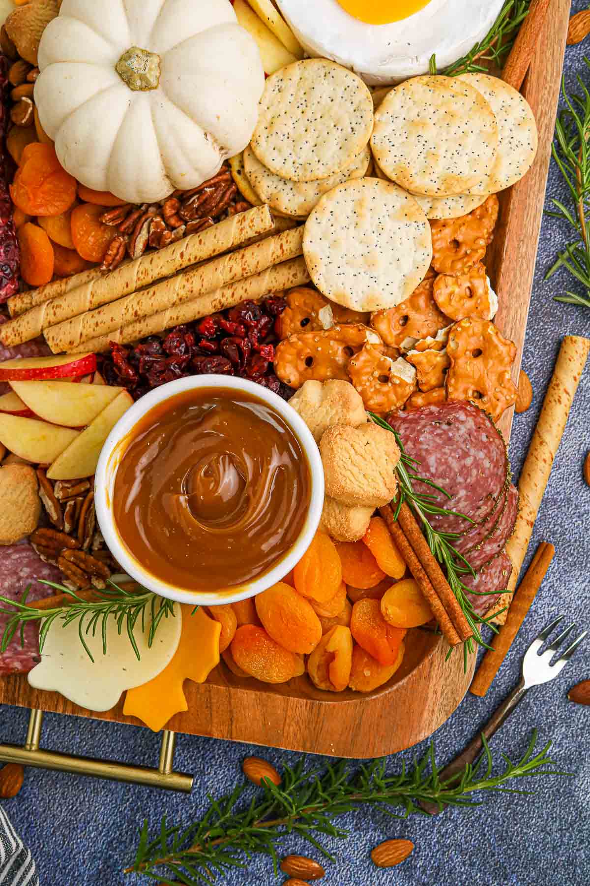 fall charcuterie board ingredients on board with dip.