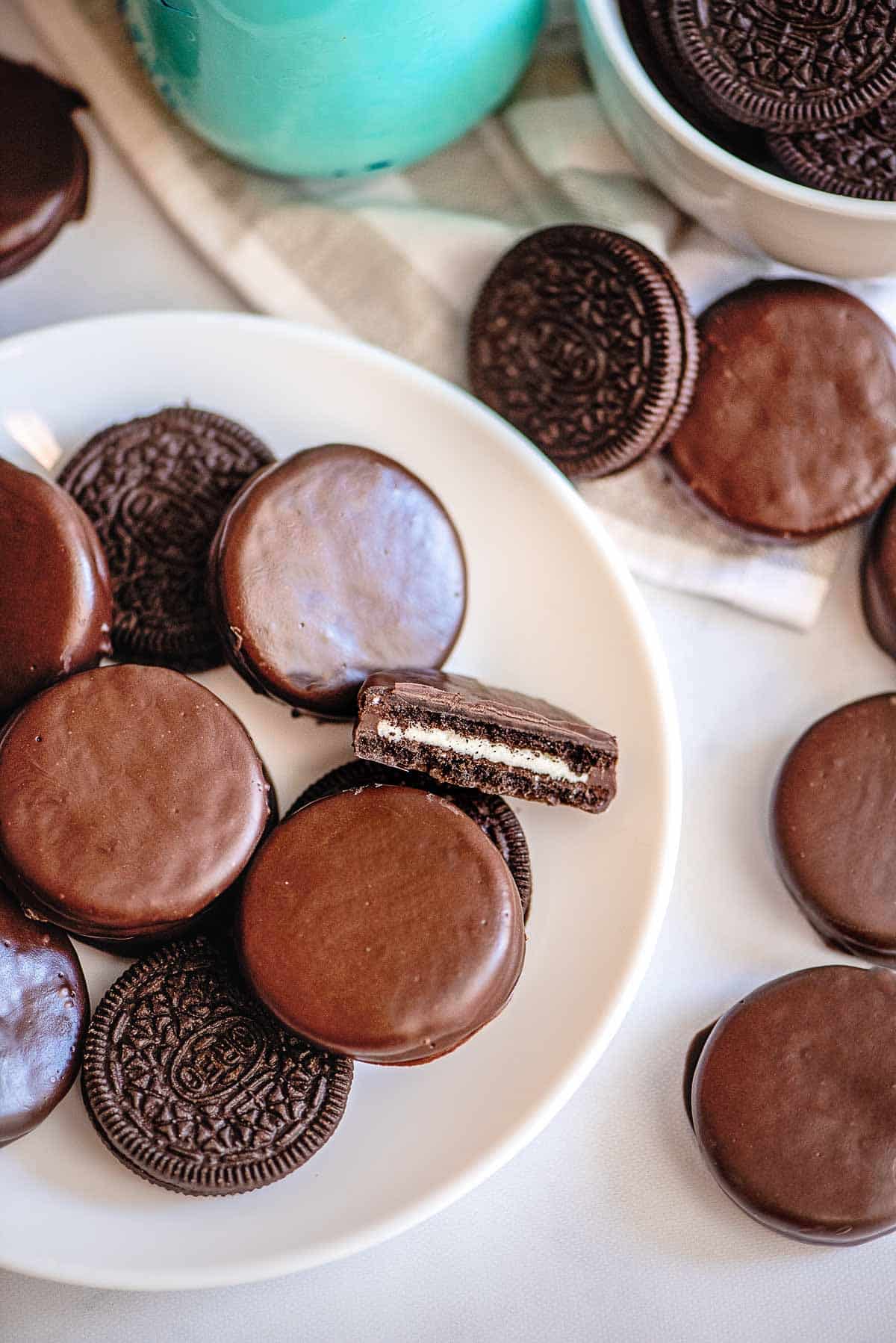 chocolate covered oreos with middle showing.