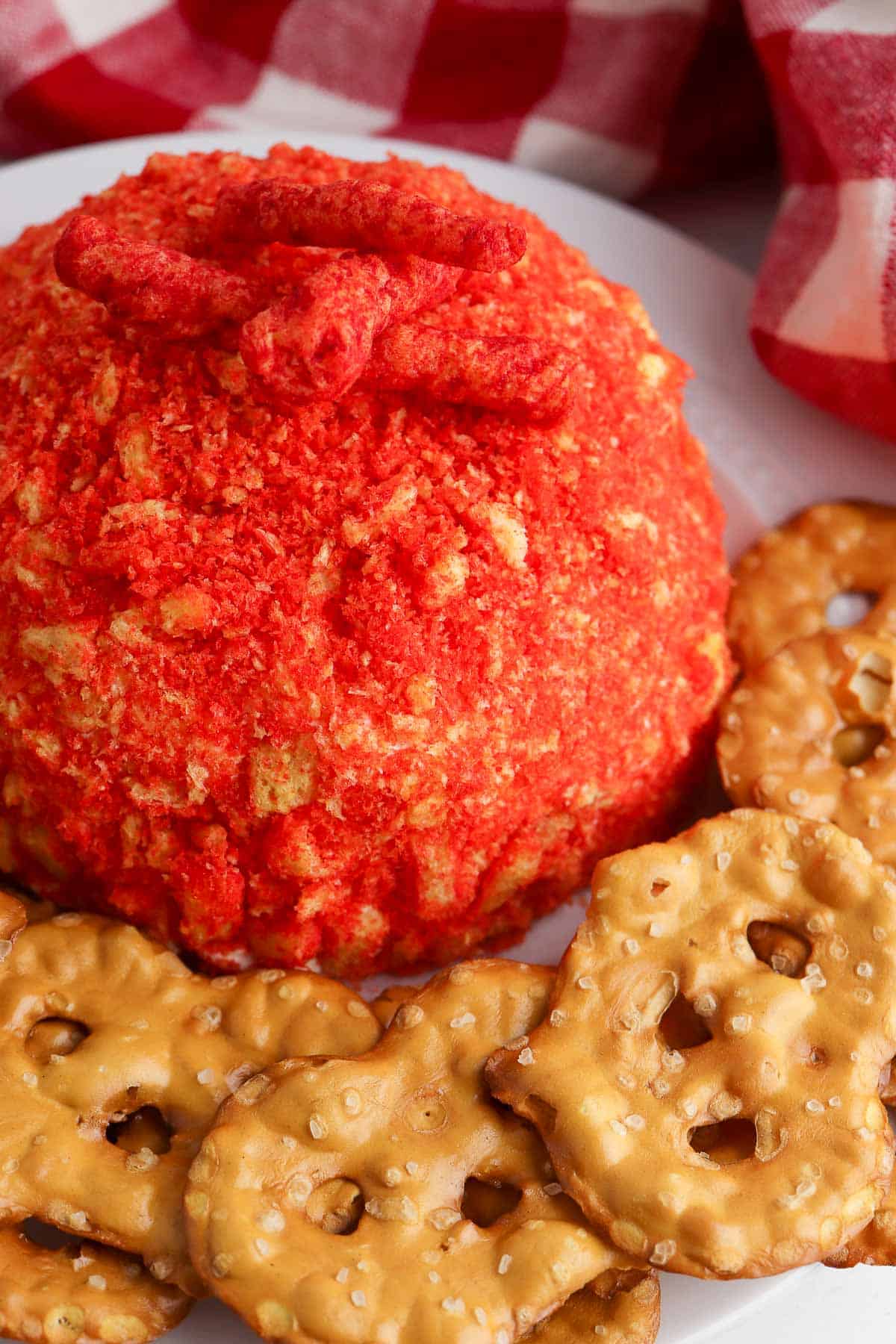 spicy cream cheese ball with pretzel crackers from above.