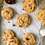 butter pecan cookies on baking sheet above.
