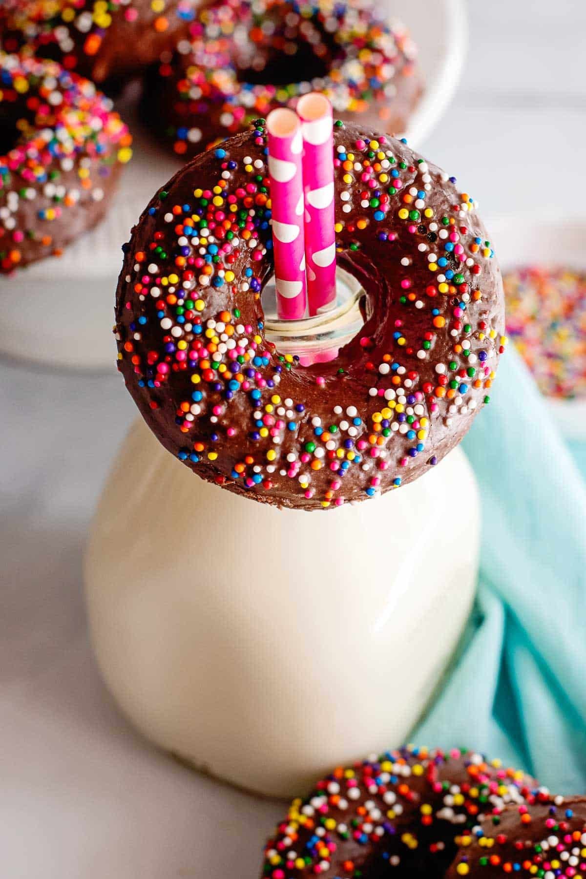 chocolate glazed donuts with milk bottle.