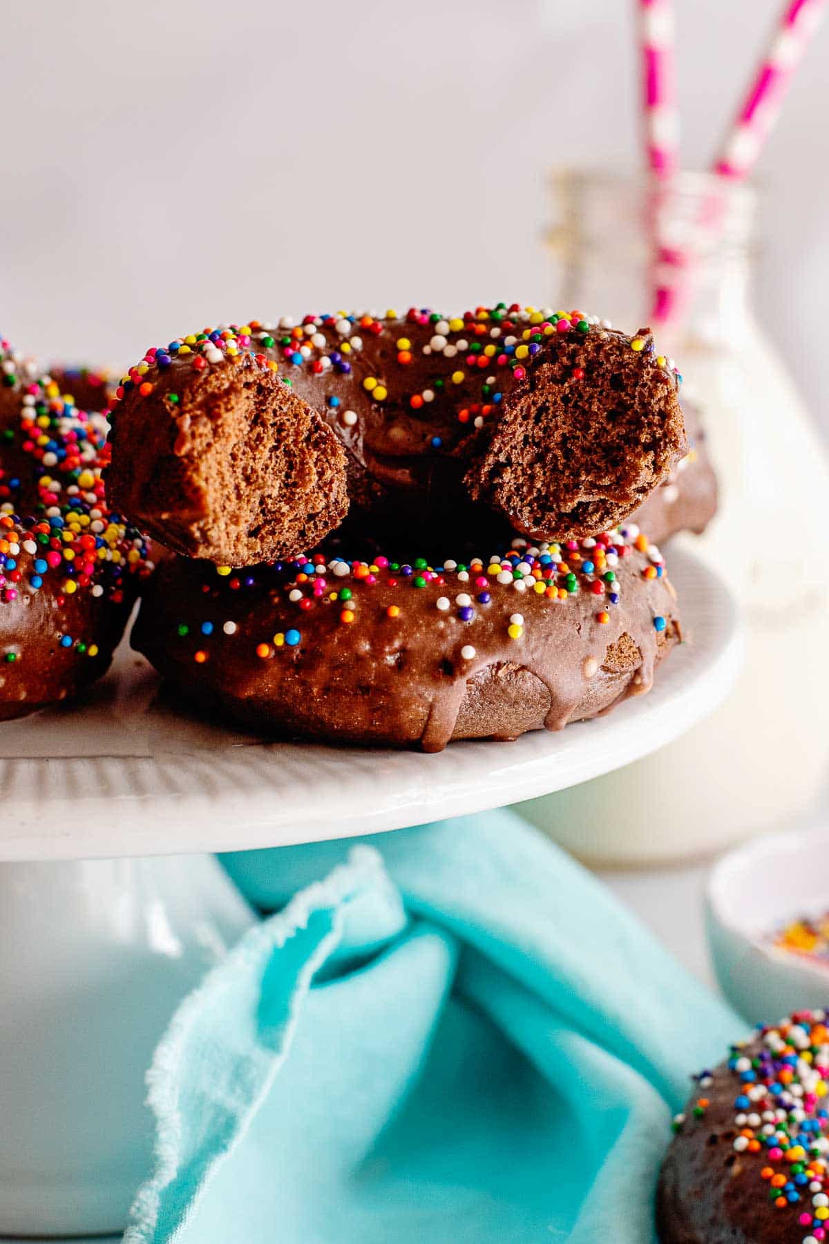 chocolate glazed donuts with sprinkles halved.